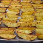 a pan filled with cooked potatoes on top of a table