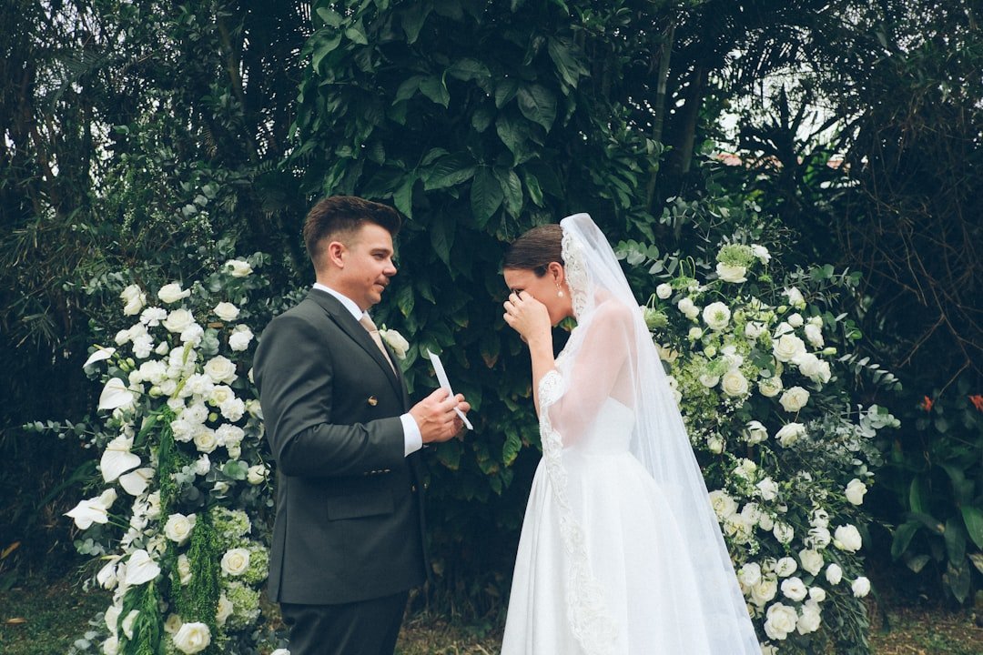 Bride crying during outdoor wedding ceremony