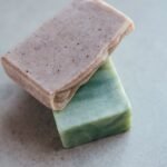 Close-up of two organic handmade soap bars, showcasing natural textures and colors.