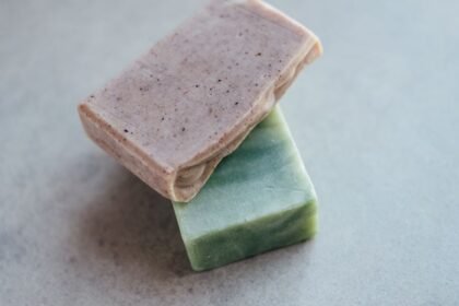 Close-up of two organic handmade soap bars, showcasing natural textures and colors.